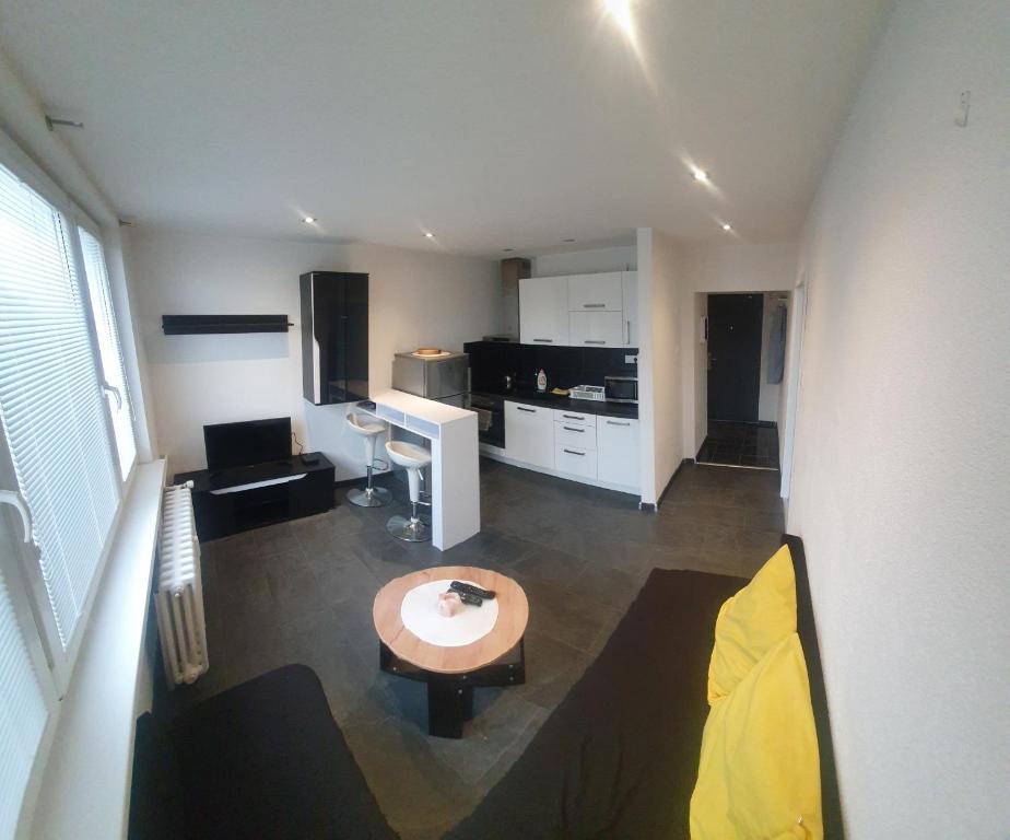 a living room with a couch and a table at Apartman Naty in Banská Bystrica