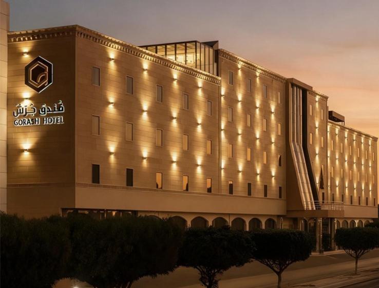 a building with lights on the side of it at Gorash Hotel in Khamis Mushayt