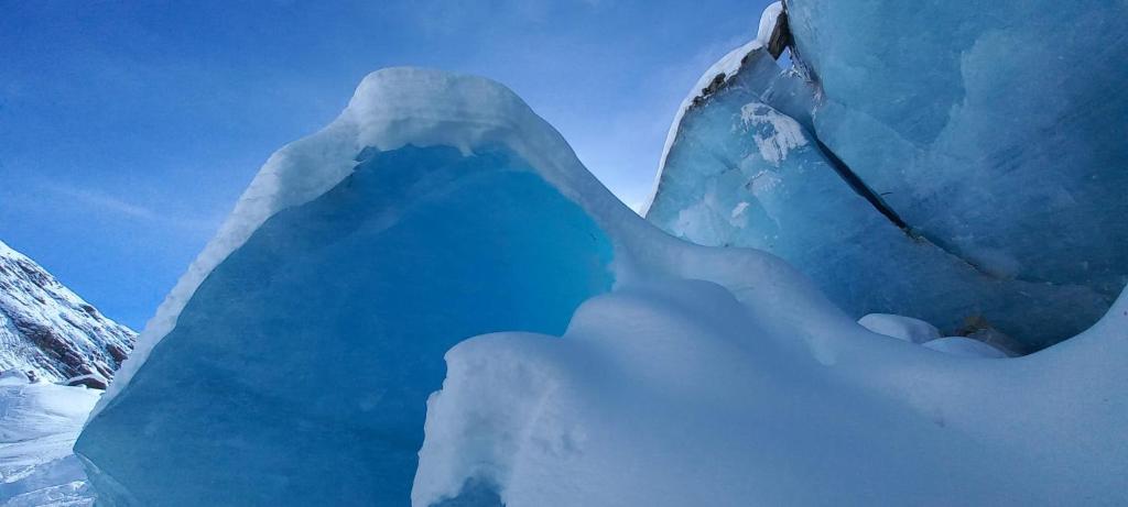 a large ice iceberg with snow on it at Castle house in Aprica