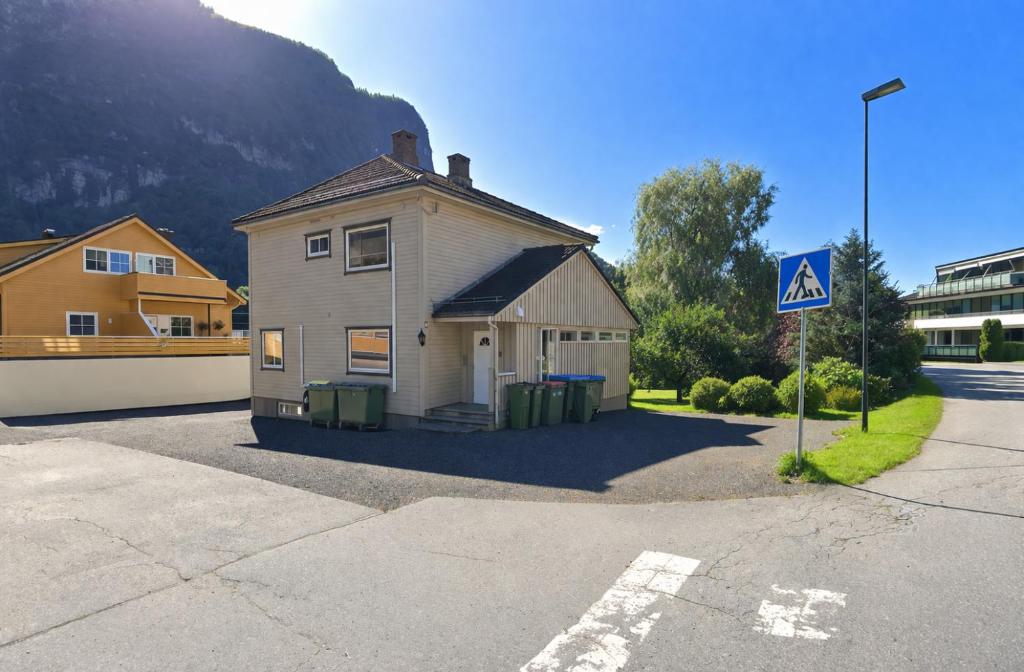 a small house on the side of a street at Spacious Apartment - City Center in Stryn