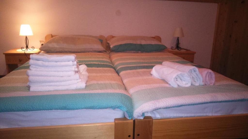 Posteľ alebo postele v izbe v ubytovaní Apartments T&M