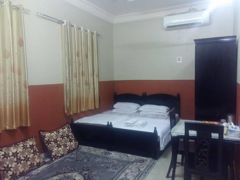 Postel nebo postele na pokoji v ubytování Five Continents Hotel