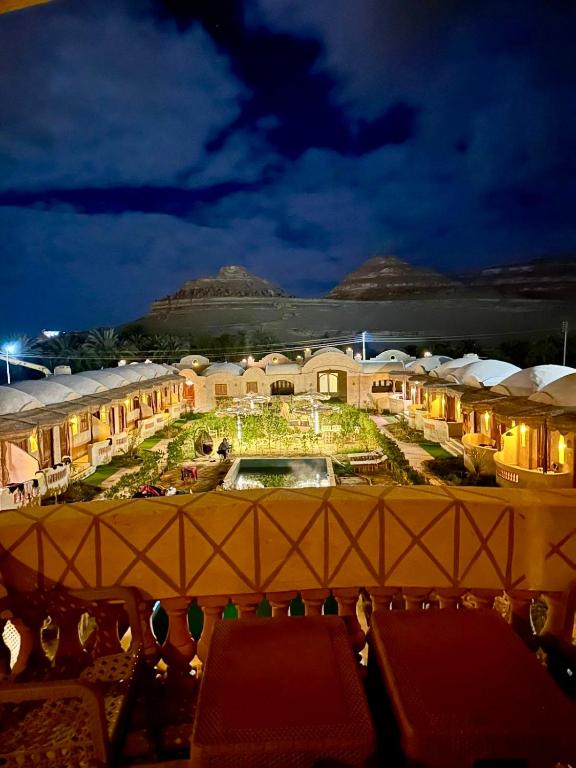a view of a resort at night at King Siwa in Siwa