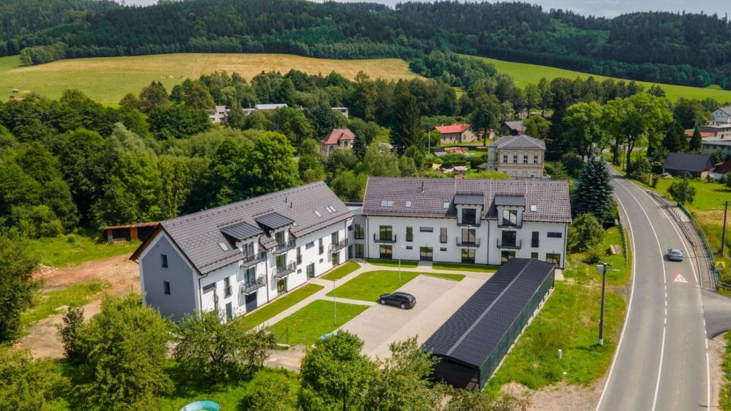 an aerial view of a large house with a road at Pobyt na Mlýně in Červená Voda