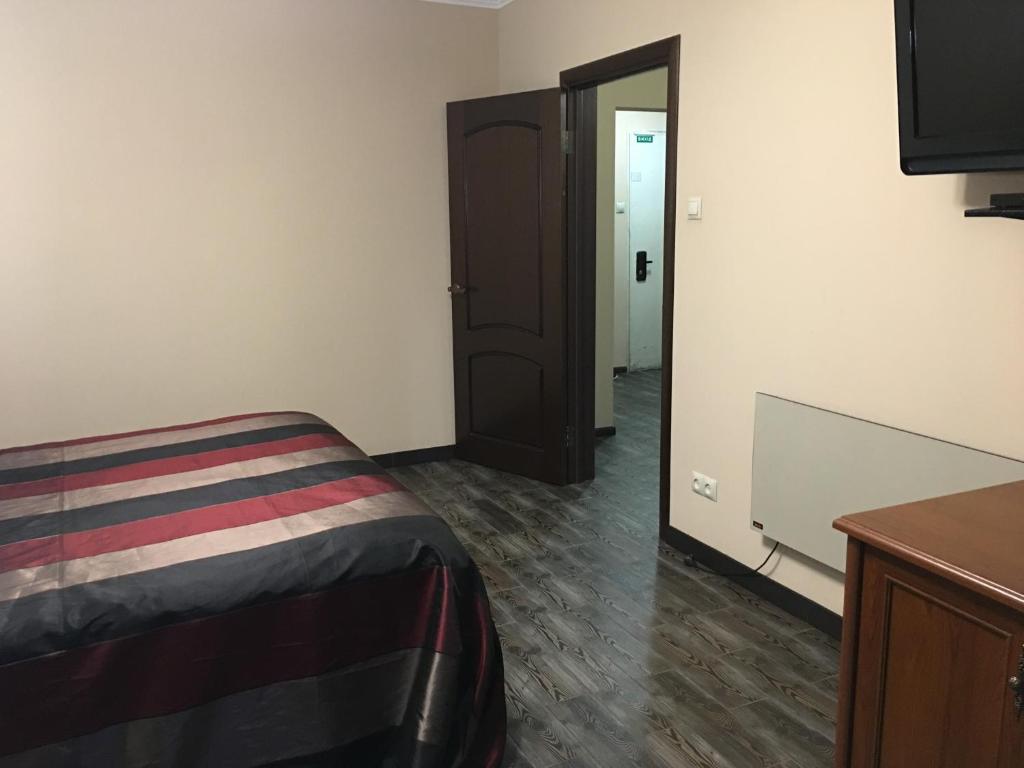 Postel nebo postele na pokoji v ubytování Alexandra Apartments
