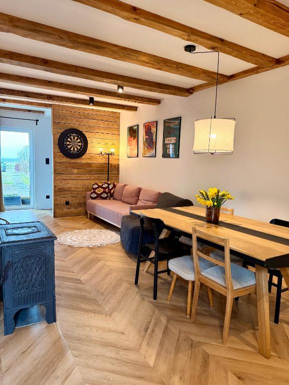 a living room with a table and a couch at Blisko in Kuźnica