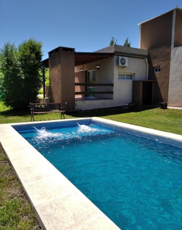 a swimming pool in front of a house at Casa brisas del rey in San Antonio de Arredondo