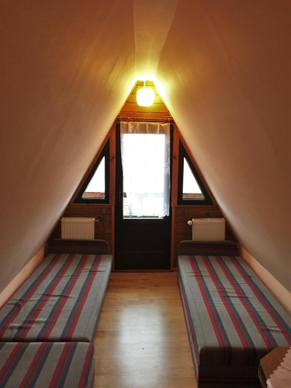 Postel nebo postele na pokoji v ubytování O.W.S. Strzecha