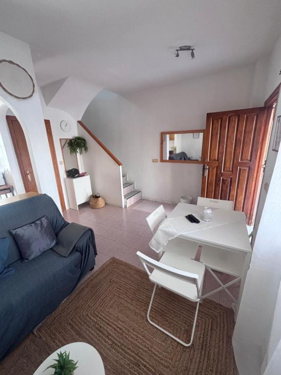 a living room with a couch and a table at Villa Banfield in Gran Alacant