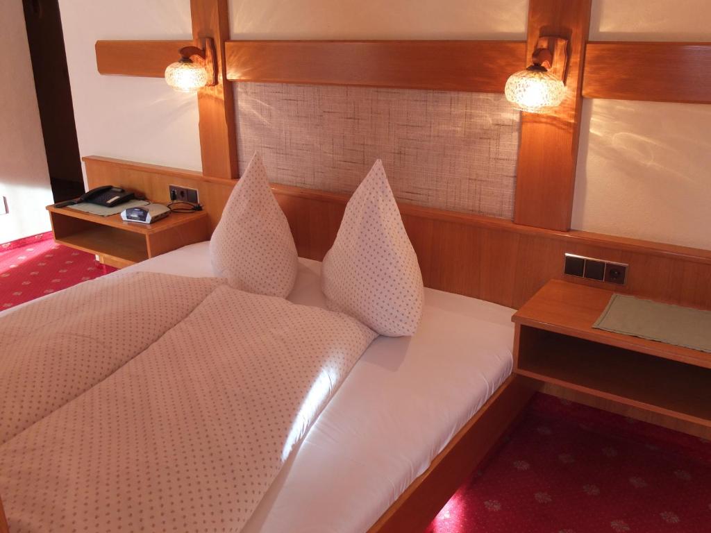 Posteľ alebo postele v izbe v ubytovaní Das Apartment Rief daheim beim Wanderprofi Adults Only