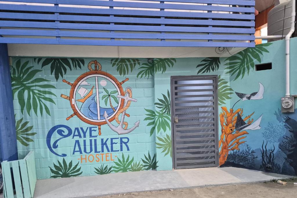 a building with a nautical mural on the side of it at Caye Caulker Hostel in Belize City