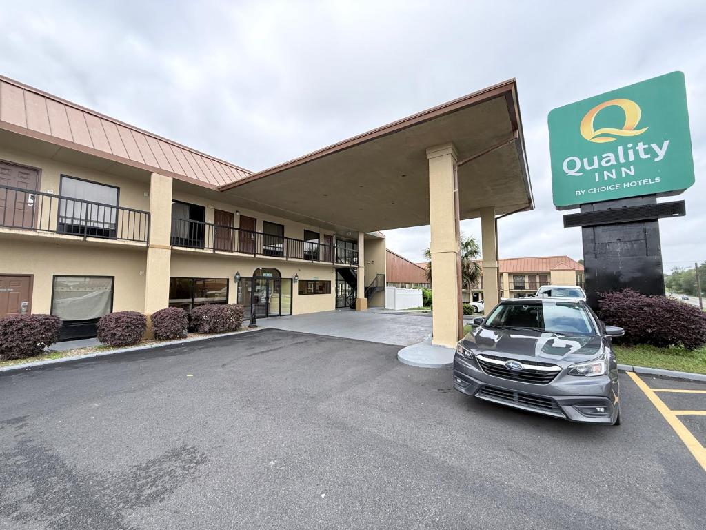 a car parked in a parking lot in front of a hotel at Quality Inn Tifton in Tifton