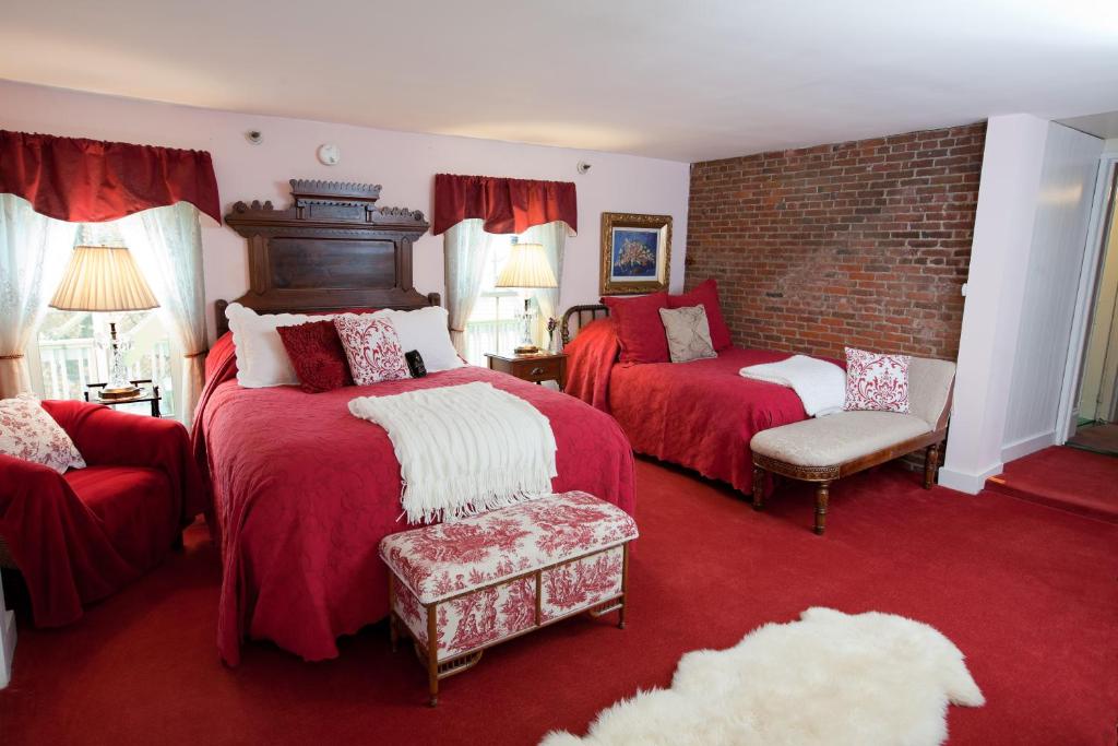 Postel nebo postele na pokoji v ubytování Inn Victoria