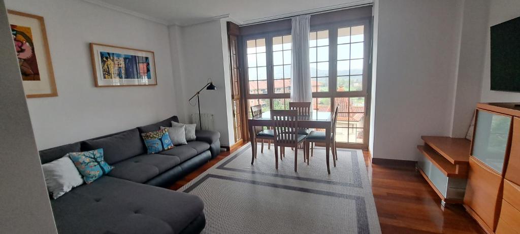 a living room with a couch and a table at Apartamento Mar in Bádames