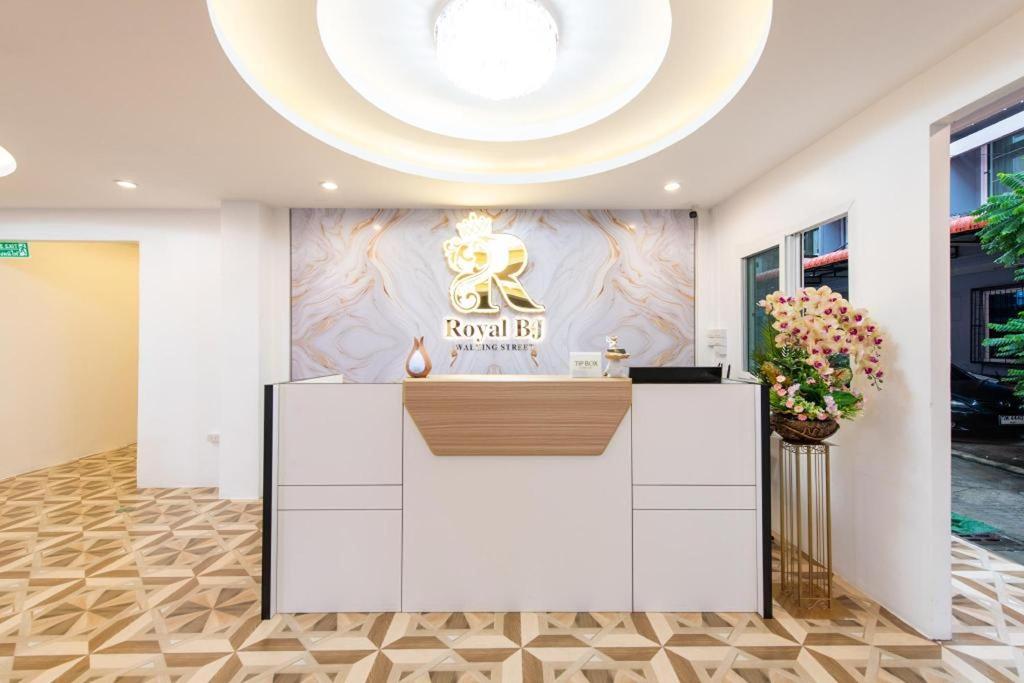 a lobby of a hotel with a reception desk at Royal BJ Hotel in Pattaya South