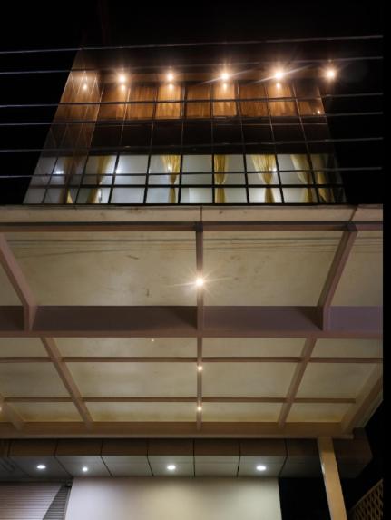 a building with a glass ceiling with lights on it at Metro Lodge in Chikmagalūr