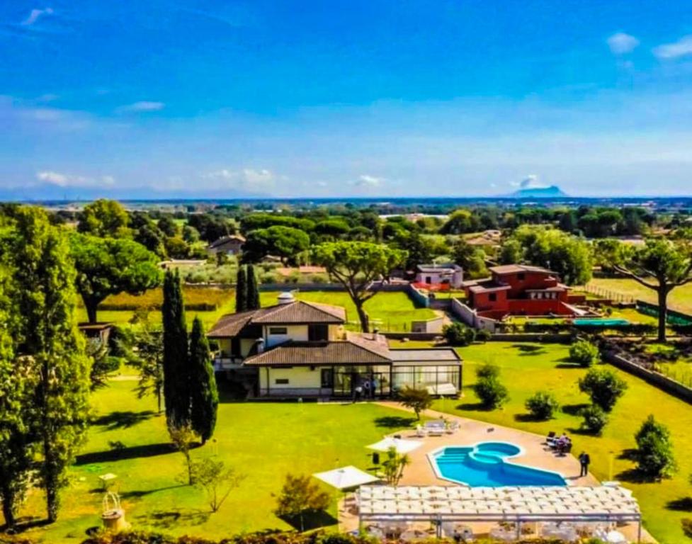 an aerial view of a estate with a swimming pool at PEPEROSA Rooms and Events - Peaceful countryside escape with pool, private parking, just minutes from the sea, Anzio and Nettuno in Nettuno
