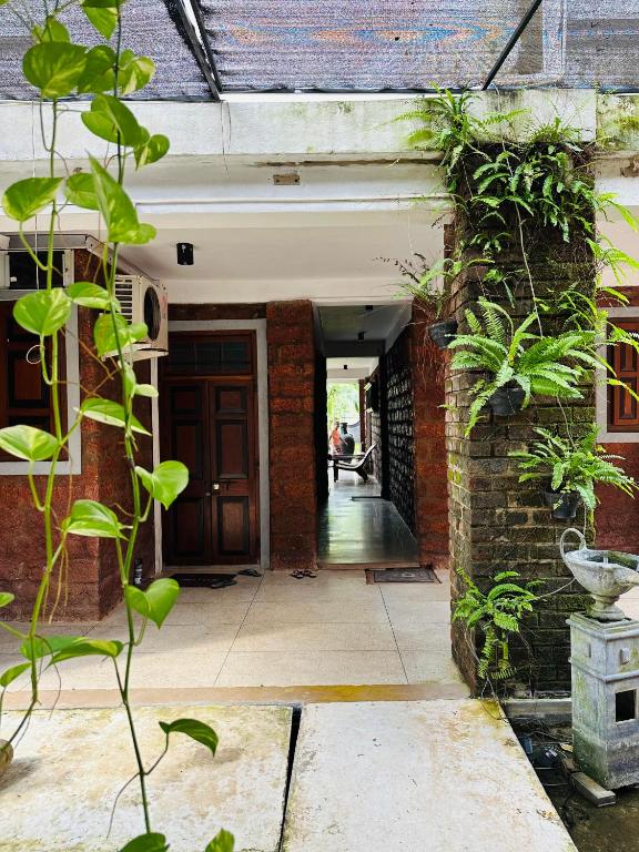 an entrance to a brick building with a door at Airport Heritege in Negombo