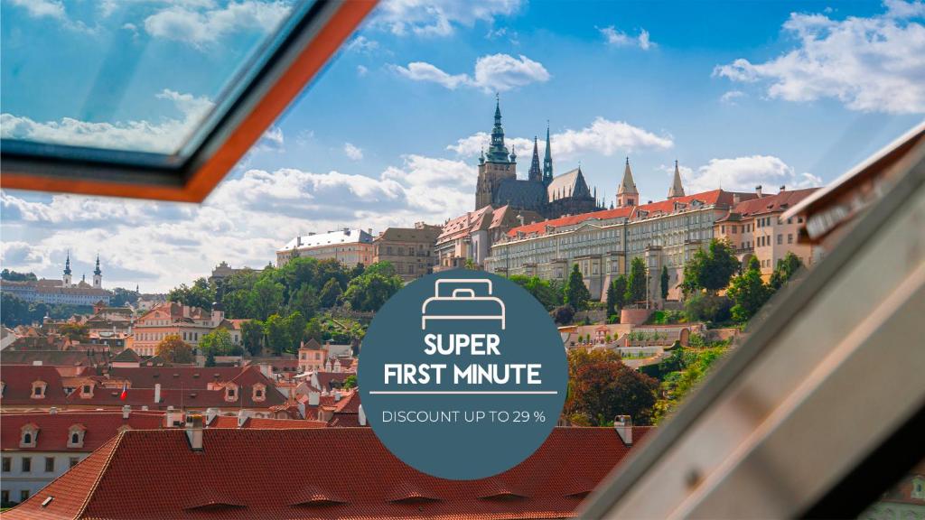 a sign in a window with a view of a city at Boutique Hotel Klarov in Prague