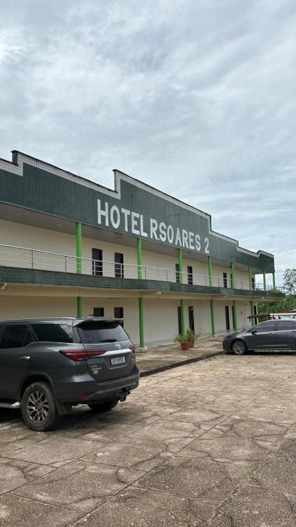 a hotel with a car parked in a parking lot at Hotel R Soares 2 in Carutapera
