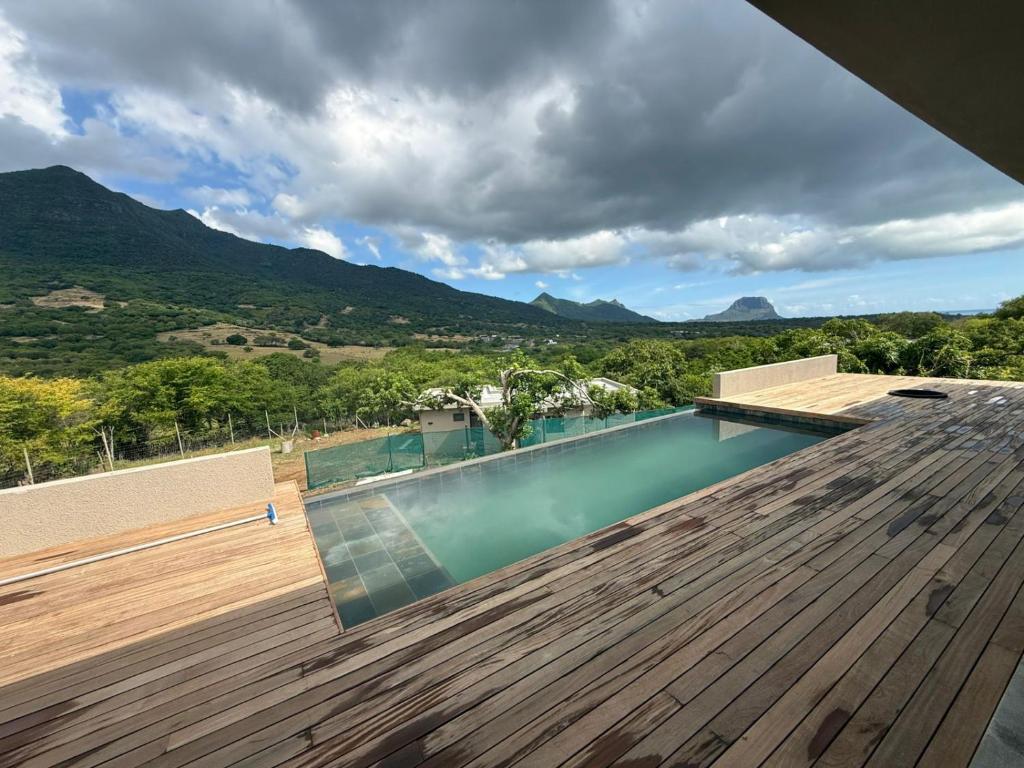 a swimming pool on the roof of a house at Casa Palmyre in Rivière Noire
