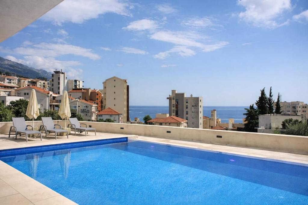 a swimming pool on the roof of a building at becici residance with pool & sauna in Budva