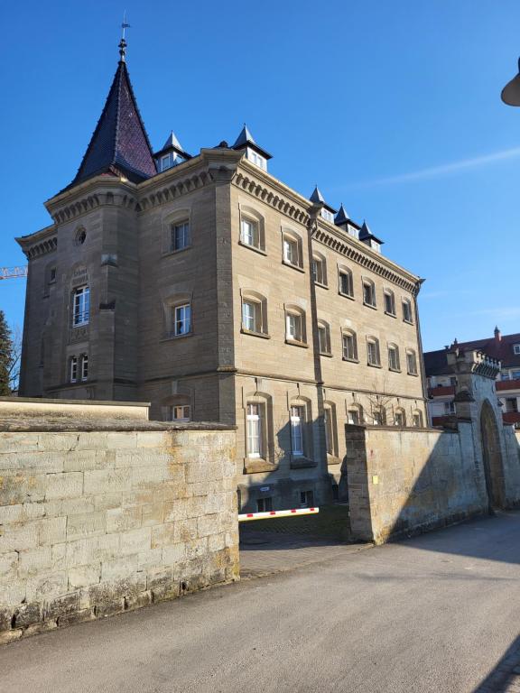a large building with a tower on top of it at Amtsstube1892 - Übernachten im alten Gefängnis in Überlingen
