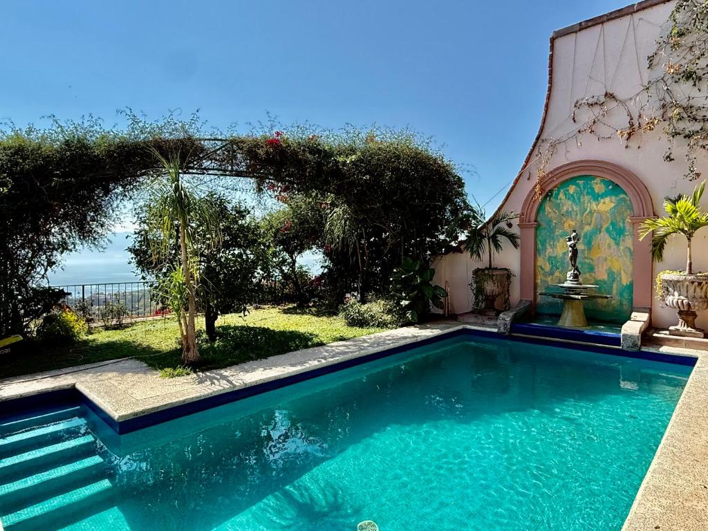 a swimming pool in front of a house at MiraLago Pool Paradise in San Antonio