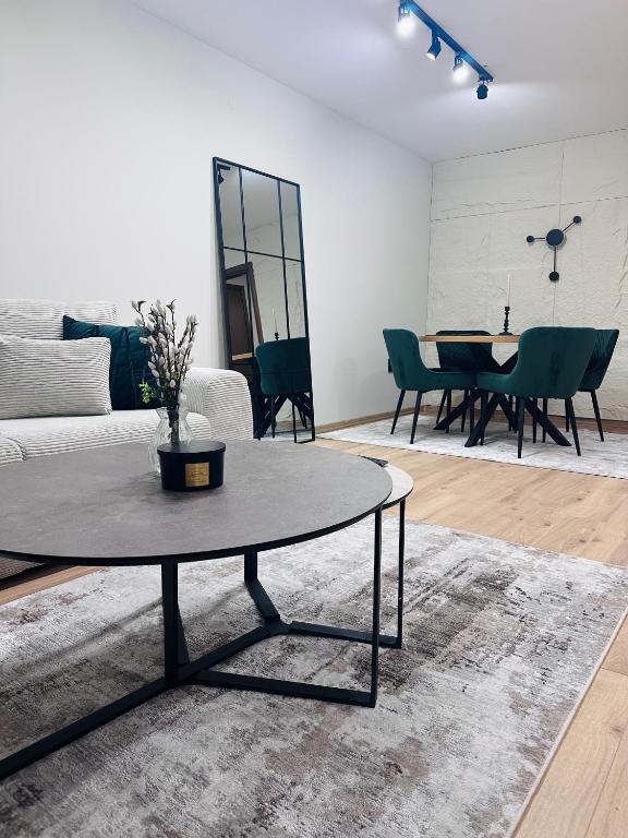 a living room with a couch and a table at martIN Apartment 2 in Bansko