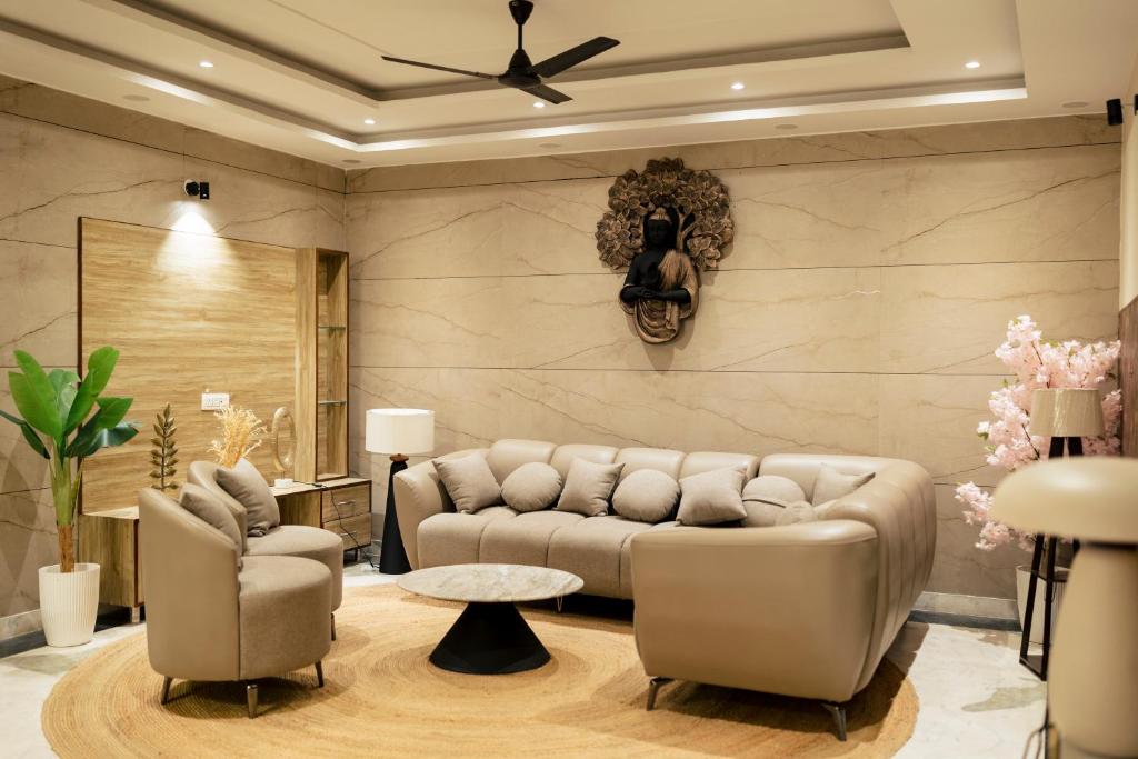 a living room with a couch and two chairs at 2Kubn retreat in Chandigarh Airport