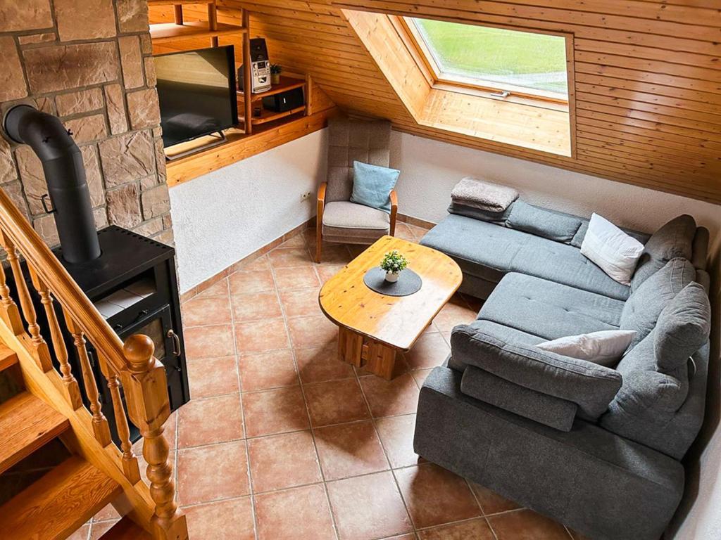 an overhead view of a living room with a couch and a stove at Hof Gottesbüren in Warburg