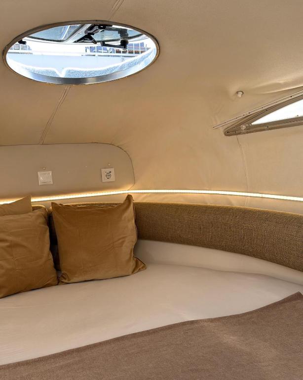 a bed in the back of a boat at HouseBoat on the river-DouroHeritage in Porto