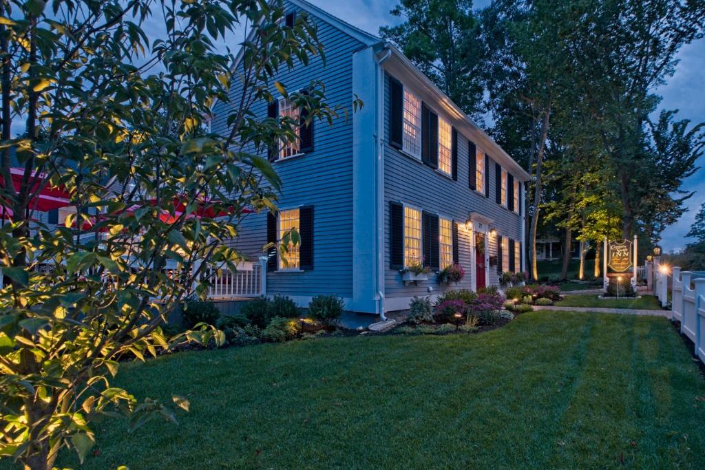 a blue house with a lawn in front of it at Captain Swift Inn in Camden