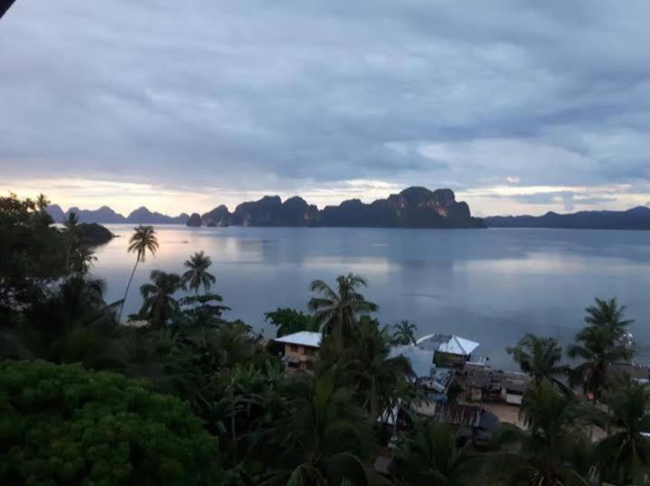 a view of a large body of water with mountains at El Nido Bayview in El Nido
