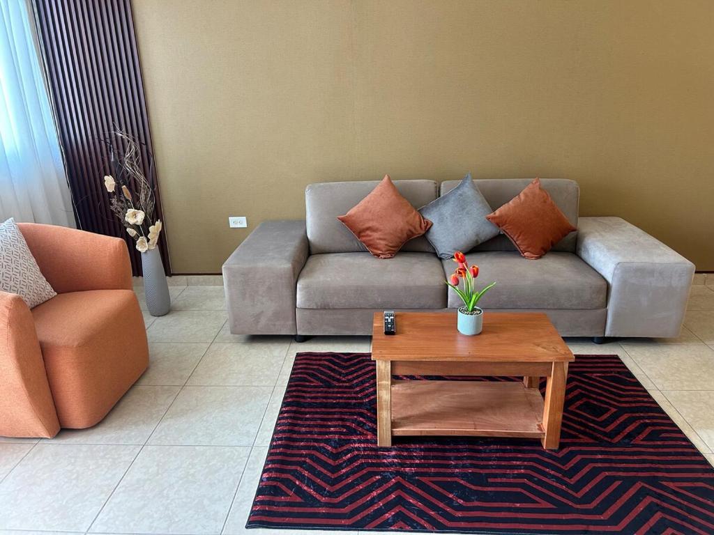 a living room with a couch and a coffee table at Oasis House 2 in Tocumen