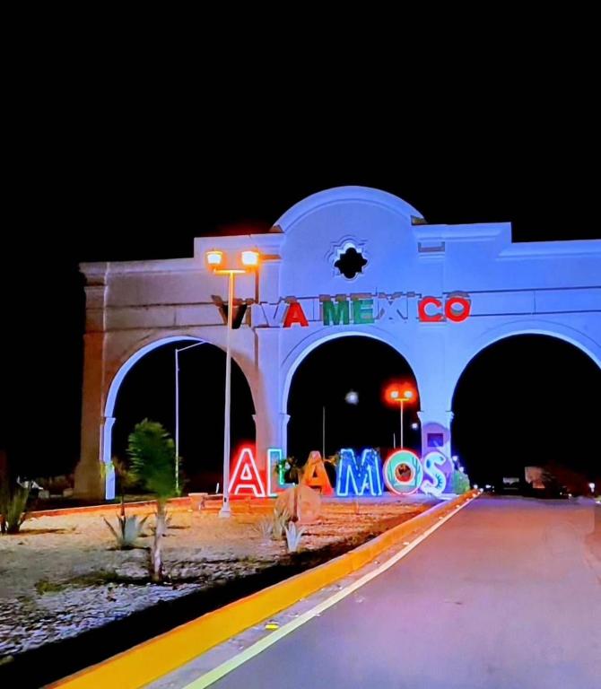 a bridge with a lit up sign in the middle of a road at Glamping in Pueblo Magico Alamos Sonora in Álamos