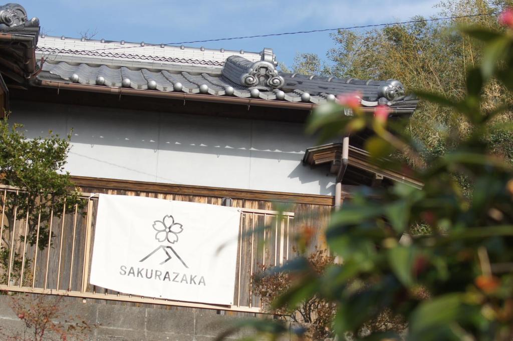 a sign on the side of a building at sakurazaka in Tanabe