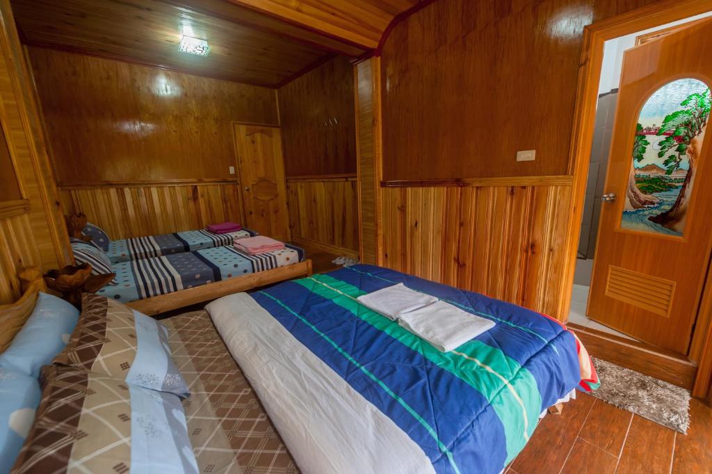 Postel nebo postele na pokoji v ubytování Rice Homestay