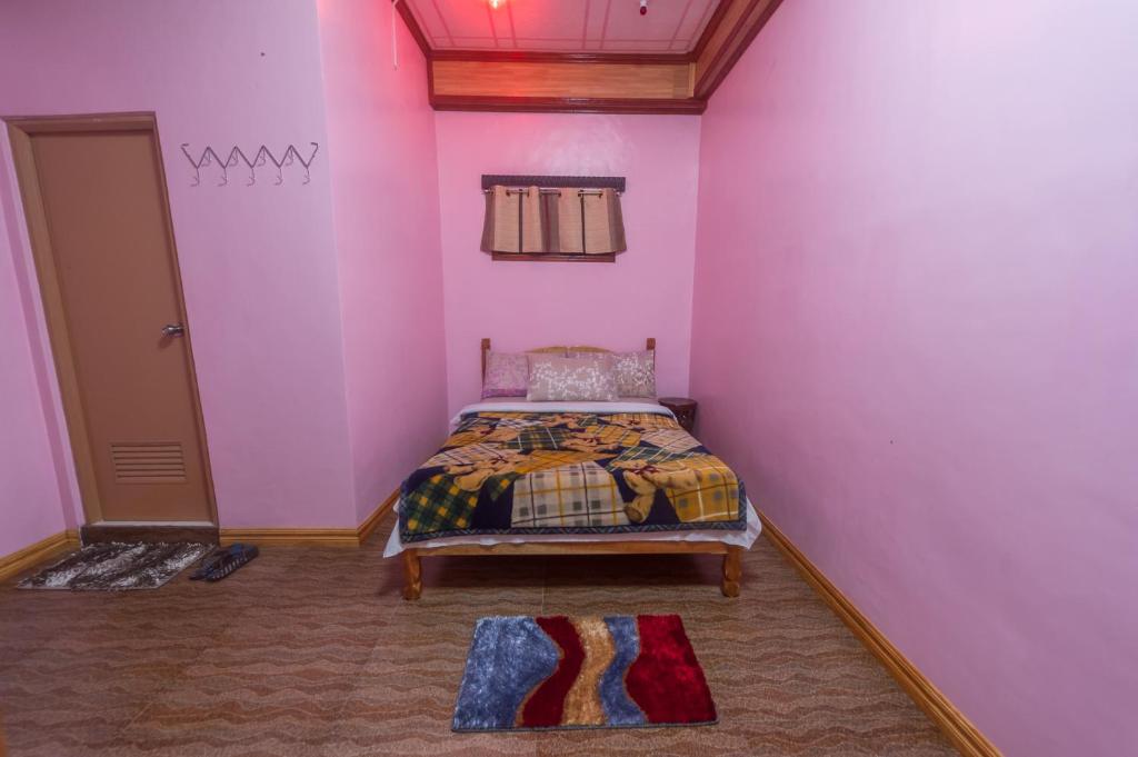 Postel nebo postele na pokoji v ubytování Rice Homestay