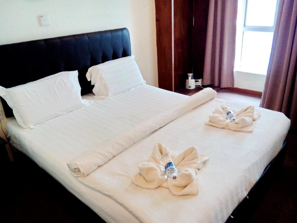 Postel nebo postele na pokoji v ubytování Alonto Hotel