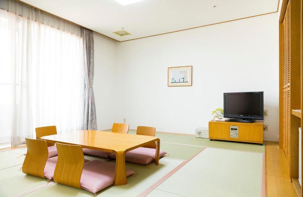 TV a/nebo společenská místnost v ubytování Kobe Hotel Fruit Flower