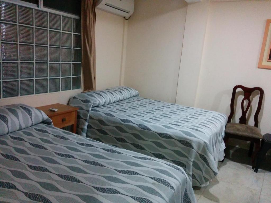 Postel nebo postele na pokoji v ubytování Hotel Mileto