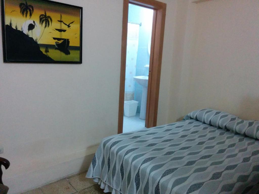 Postel nebo postele na pokoji v ubytování Hotel Mileto