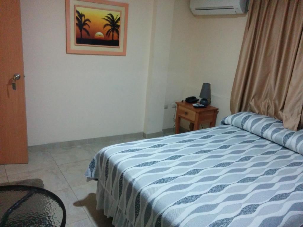 Postel nebo postele na pokoji v ubytování Hotel Mileto