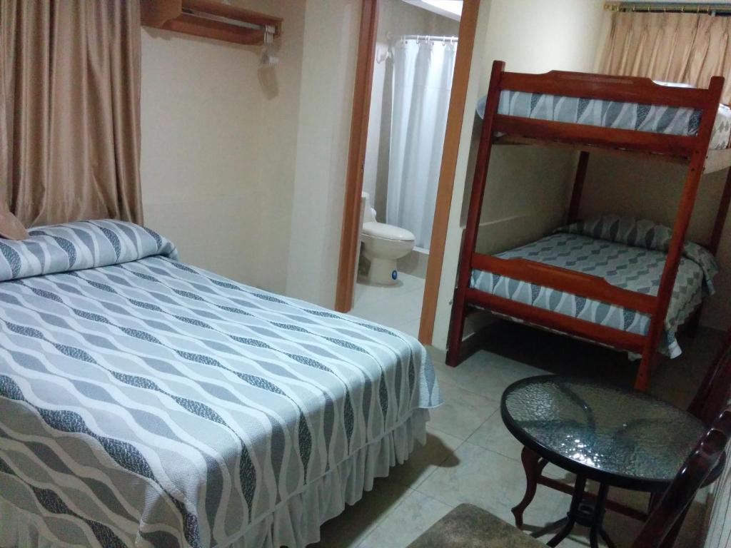 Postel nebo postele na pokoji v ubytování Hotel Mileto