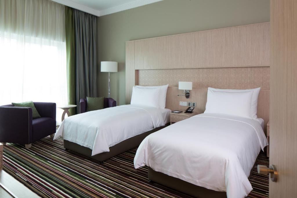 Postel nebo postele na pokoji v ubytování Dusit D2 Kenz Hotel Dubai