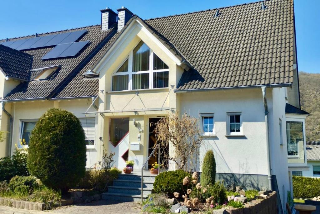 a house with solar panels on the roof at Mosel mit Herz in Cochem