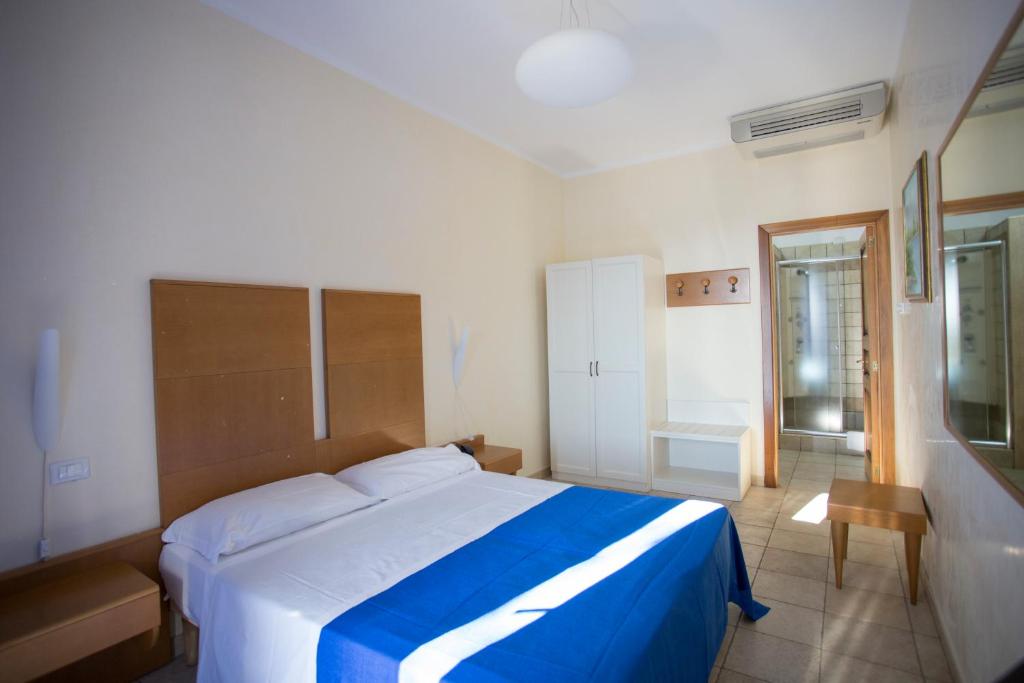 Postel nebo postele na pokoji v ubytování Hotel Resort Portoselvaggio