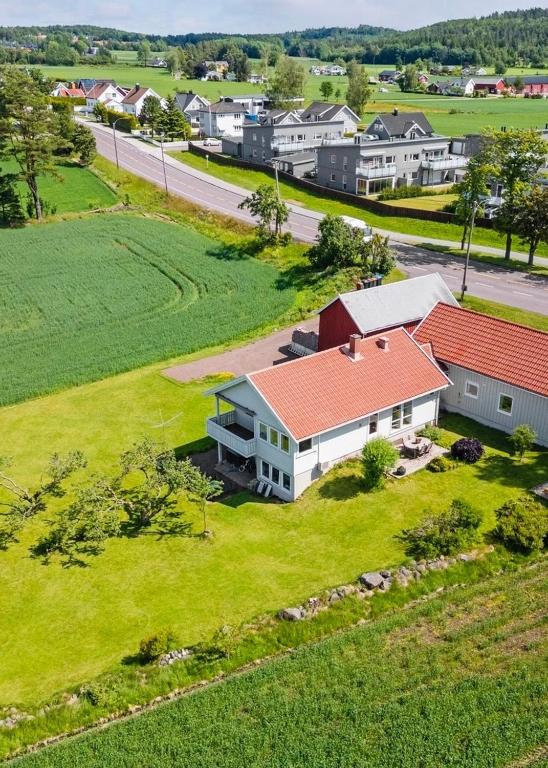 an aerial view of a house in a field at Large apartment with parking in Sandefjord