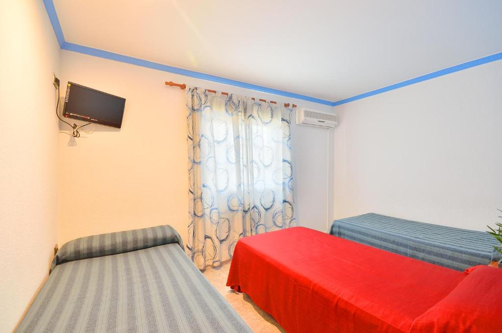 Posteľ alebo postele v izbe v ubytovaní Hostal Apolo Trece